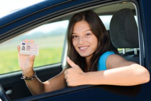 <img src="driver's license.jpg" alt="Smiling woman won her Michigan driver's license restoration. ">